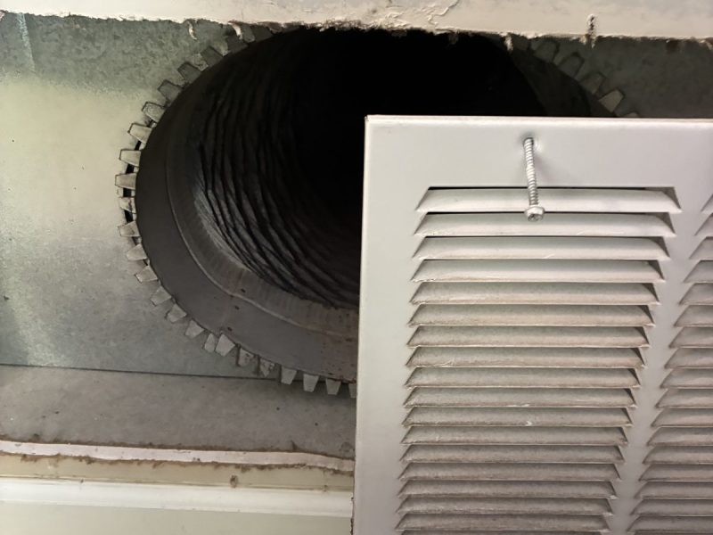 Open air-duct register showing the HVAC duct behind it — air duct cleaning NJ