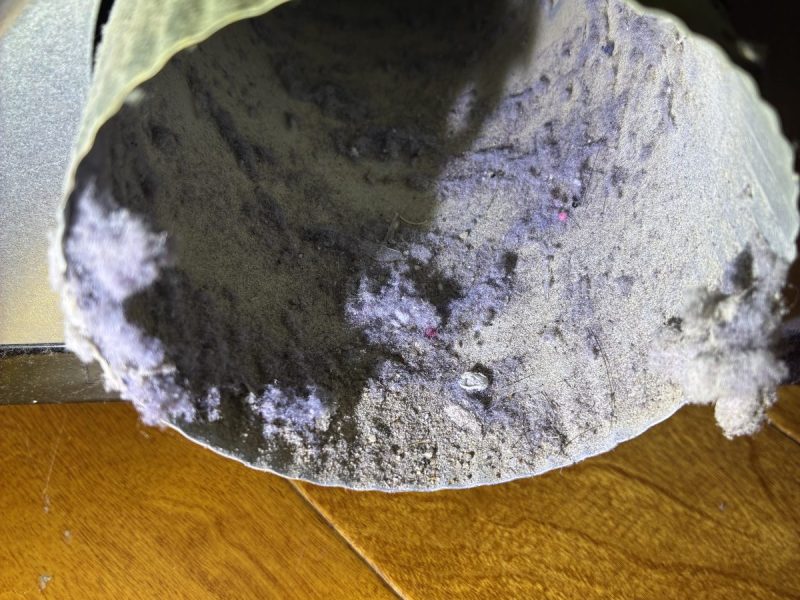Dryer vent packed with lint before cleaning — SPR Vent Cleaning, New Jersey