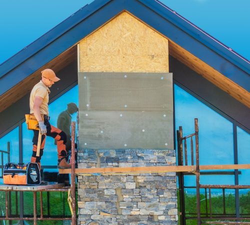 Professional,Contractor,Installing,Elegant,Rock,Made,Chimney,Facade